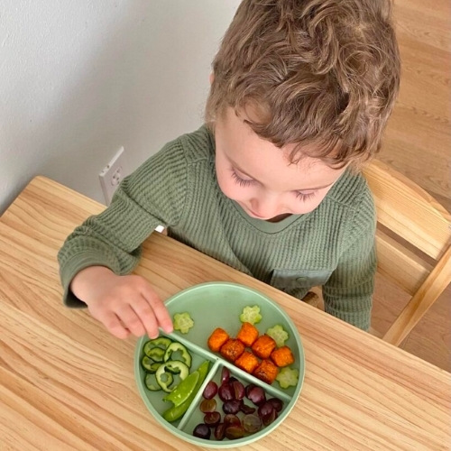Boy sitting at table eating