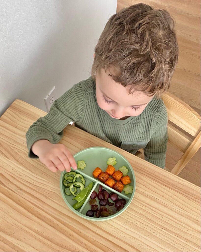 3 Year old lunch plate at table.