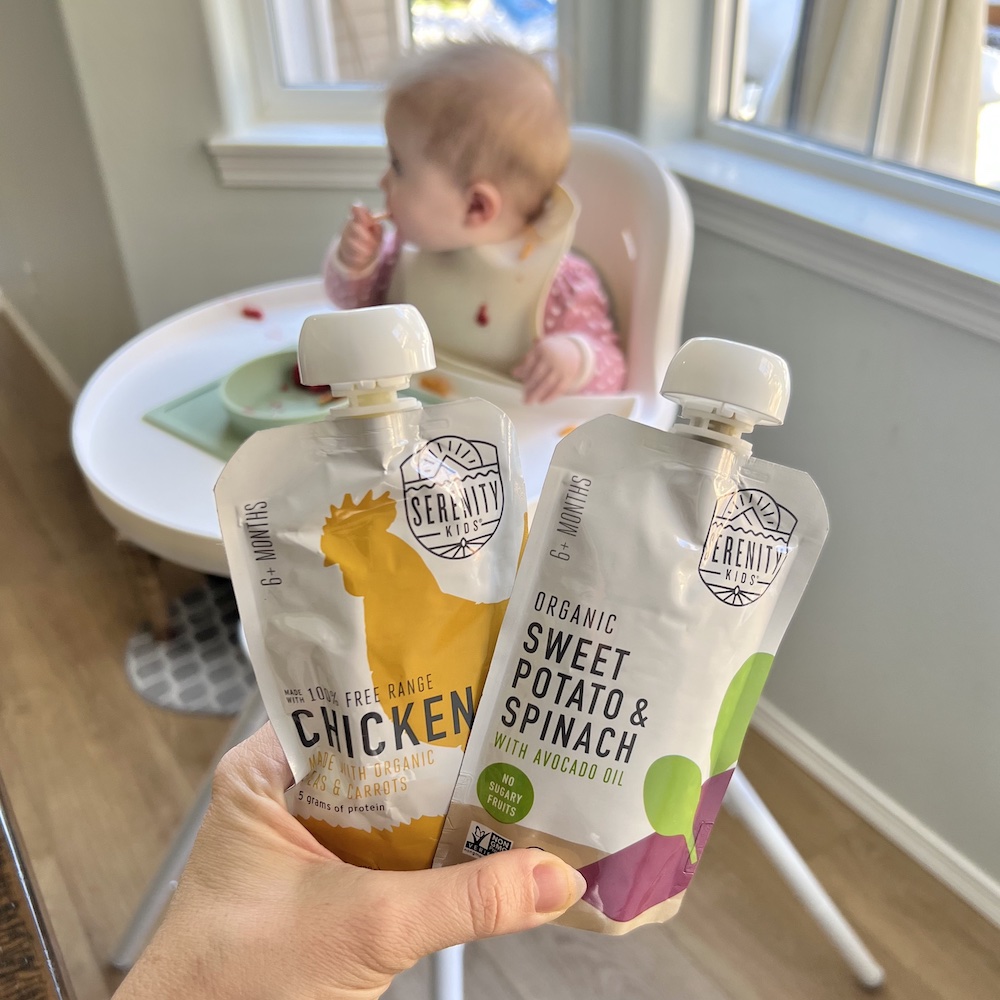 Baby with baby food pouches from Serenity Kids