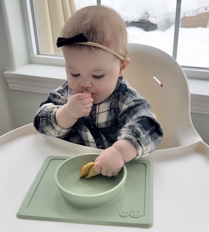 Baby eating pancakes