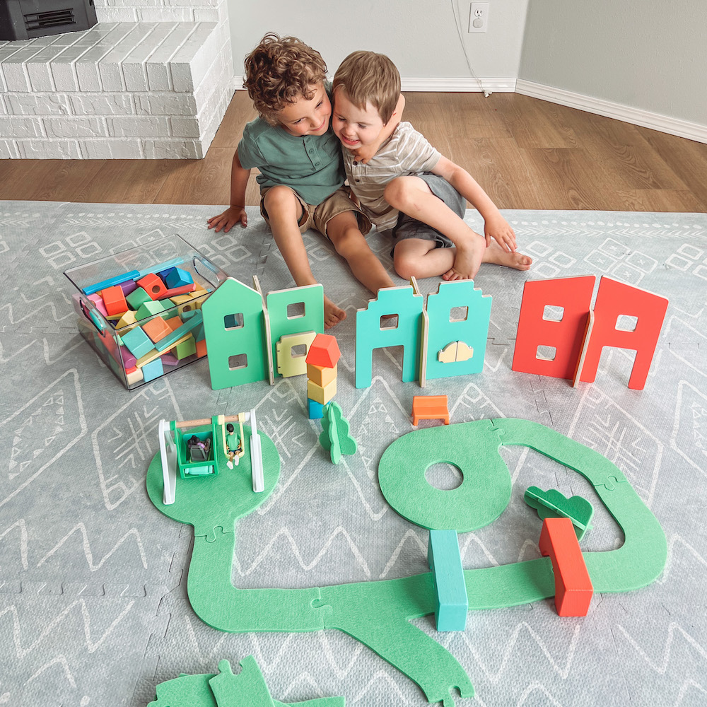 Boys with road and building toys