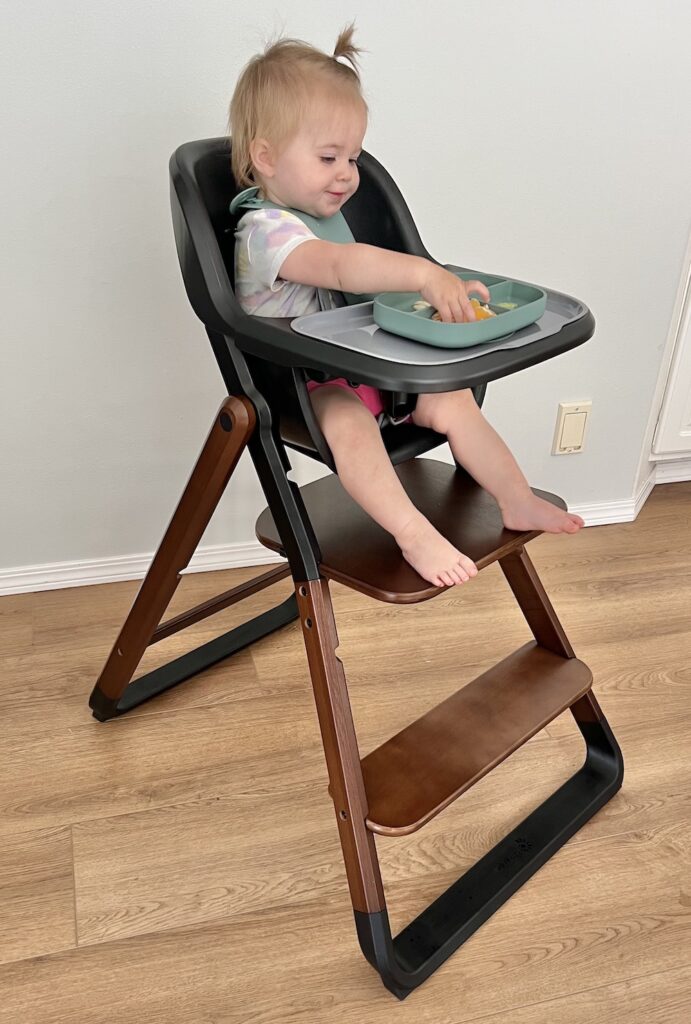 Baby eating in ergo 3-in-1 high chair