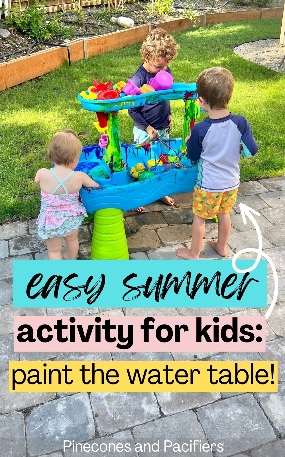 easy-summer-activity-paint-the-water-table-pinecones-pacifiers