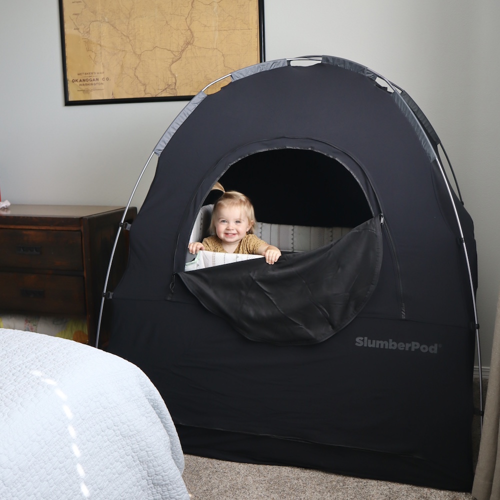 Baby in slumberpod in bedroom.