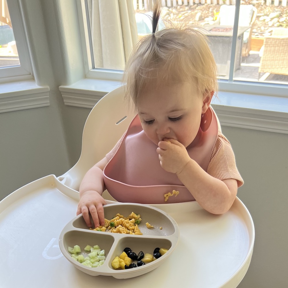 1 Year Old Meals: girl eating out of toddler plate