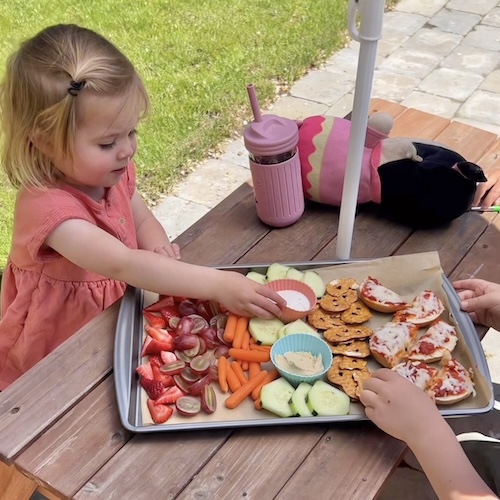 girl eating sheet pan lunch